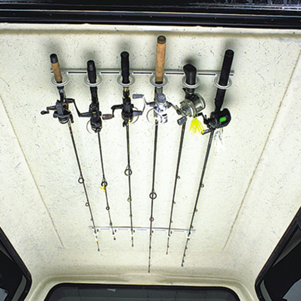 Fishing rods safely stored in Dubro rod racks inside of a truck cap.