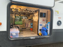 Trac-a-rod fishing rod rack mounted in a camper rv