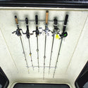 Fishing-poles safely stored in Dubro rod racks inside of a truck cap.
